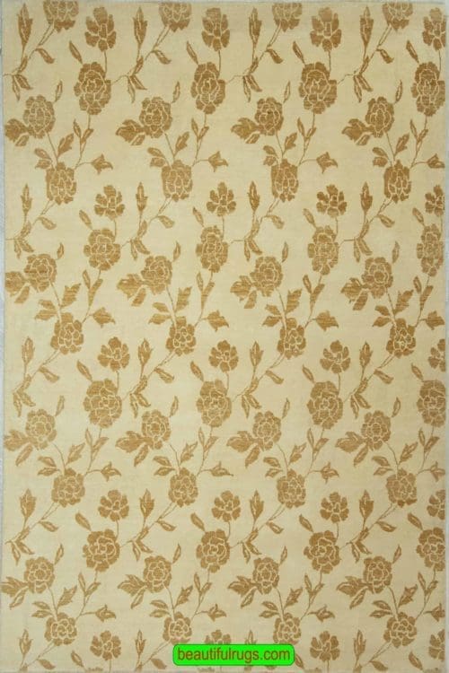 Floral modern rug from India, beige color with brown flowers. Size 6.4x8