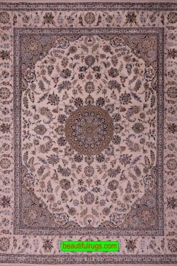 Handmade wool and silk rug made in India with Persian Nain pattern in beige and blue color