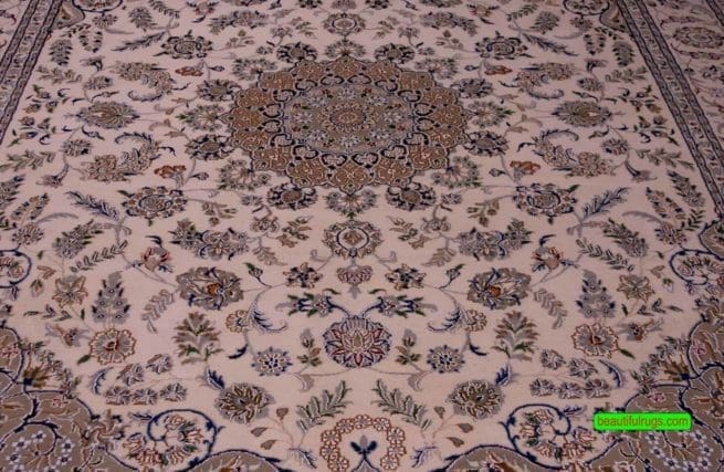 Handmade wool and silk rug made in India with Persian Nain pattern in beige and blue color