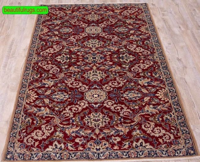 Persian Nain rug made of wool and silk in red color. Size 3.7x5.7