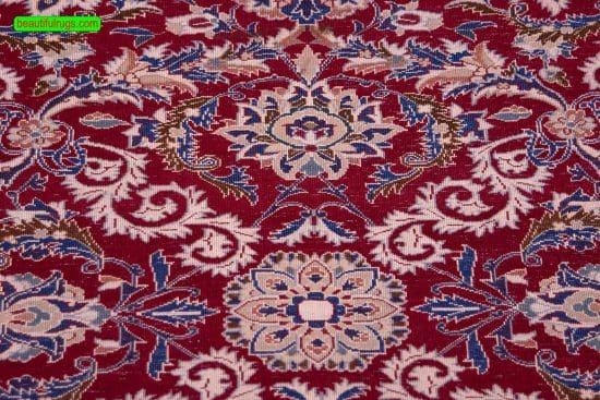 Persian Nain rug made of wool and silk in red color. Size 3.7x5.7