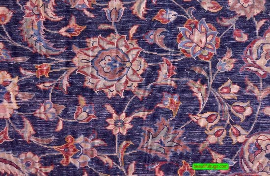 Hand knotted floral Persian Sarouk rug with navy blue filed and red border