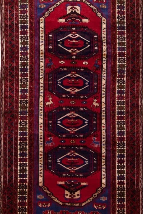 Wide Persian Baluchi runner rug with red and blue colors. Size 4.5x9.8