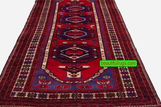 Wide Persian Baluchi runner rug with red and blue colors. Size 4.5x9.8