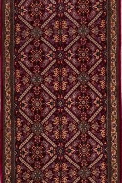 Persian Qum runner rug made of wool in red color. Size 2.10x13.6