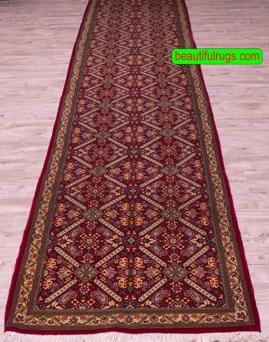 Persian Qum runner rug made of wool in red color. Size 2.10x13.6