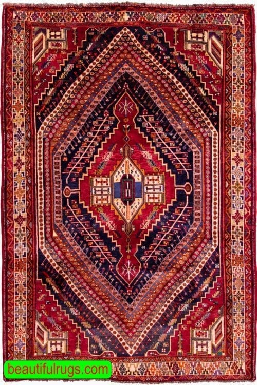Geometric Persian Shiraz wool rug in red color. Size 6.3x9.2