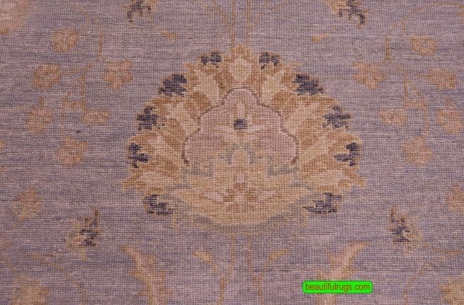Vintage blue oriental rug with beige border, floral style. Size 8.1x10