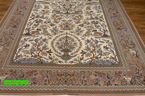 Persian Isfahan beige color rug, wool and silk rug with birds and animals. Size 7x9.9.