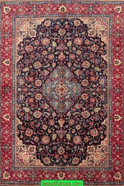 Types of Persian rug, hand knotted floral Persian Saruk rug in navy blue and red color. Size 6.3x9.10.