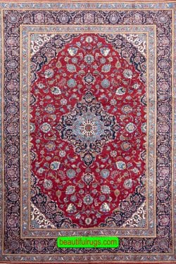 Persian Kashan rug in red and navy blue color. Size 7.10x11.1