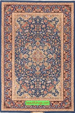 Persian Isfahan wool and silk rug with blue and gold colors. Size 4x6