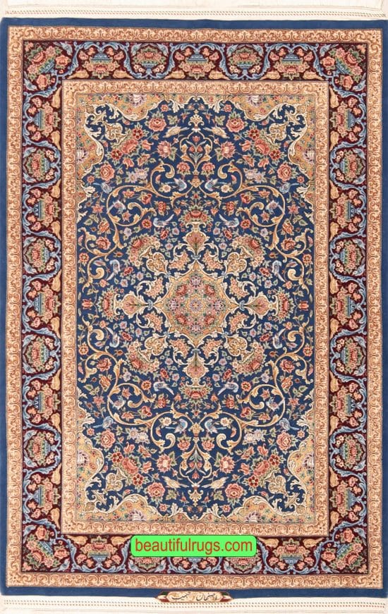 Persian Isfahan wool and silk rug with blue and gold colors. Size 4x6