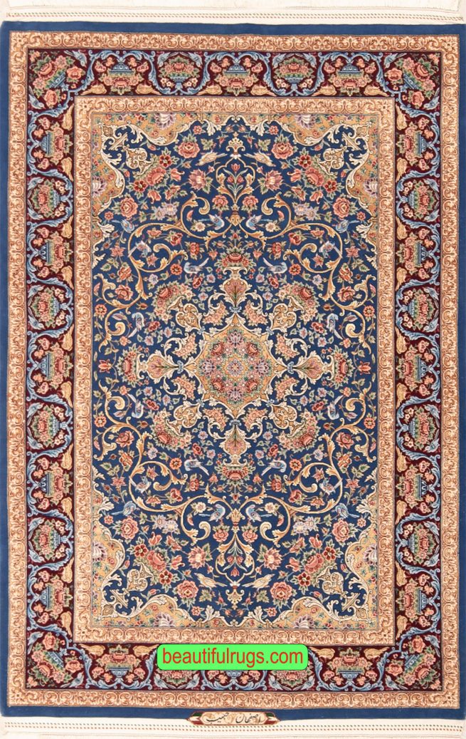 Persian Isfahan wool and silk rug with blue and gold colors. Size 4x6