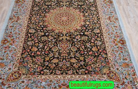 Persian Qum wool and silk rug, with black and green colors. Size 4.7x7