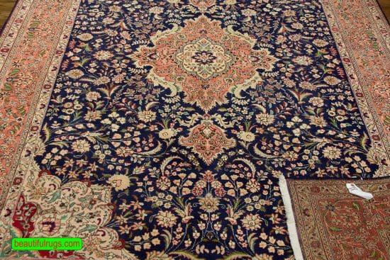 Hand knotted Persian Tabriz wool rug in navy blue and salmon color. Size 6.8x10.