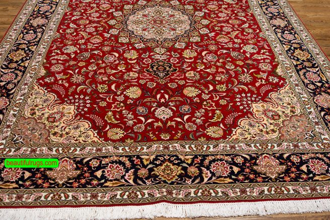 Persian Tabriz wool and silk rug in orange red and black colors. Size 8.3x11.8