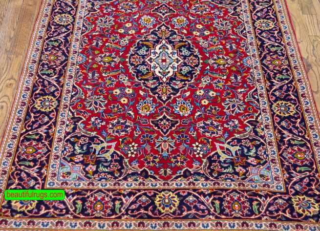 Handmade Persian Kashan carpet in red color. Size 3.6x5.2.