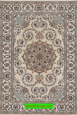 Persian Isfahan area rug in beige and taupe colors made of wool and silk. Size 3.8x5.7