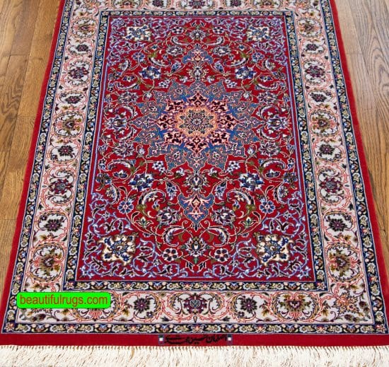 Hand knotted Persian Isfahan rug in red color, made of wool on silk foundation. Size 2.9x4.2