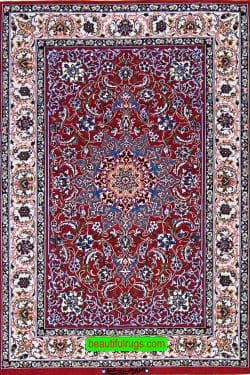 Hand knotted Persian Isfahan rug in red color, made of wool on silk foundation. Size 2.9x4.2