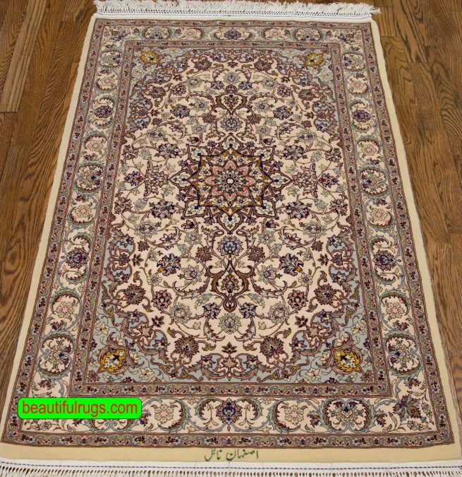 Handmade Persian Isfahan silk and wool rug in beige and earth tone colors. Size 2.9x4.6.