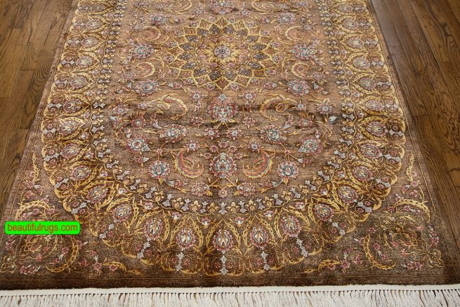 Handmade brown Persian silk rug with brown and gold colors. Size 4.4x6.9.