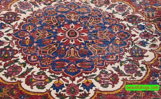 Antique Persian Bakhtiari rug in red color and perfect condition. Size 10.7x14