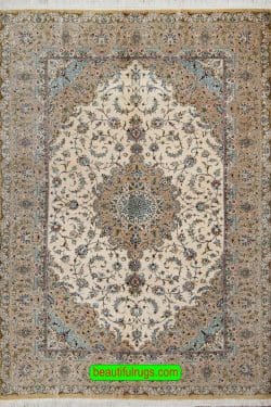 Pure silk Persian Kashan rug in beige and earth tone colors. Size 4.6x6.8.