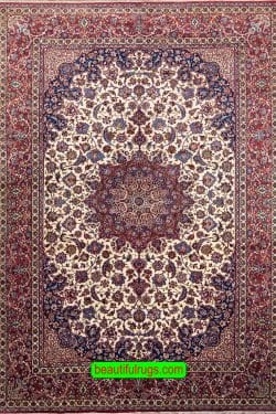 Antique Persian Isfahan rug with beige and red colors. Size 10.2x15.7.