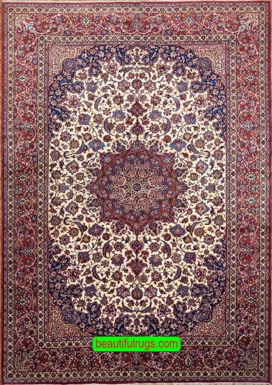 Antique Persian Isfahan rug with beige and red colors. Size 10.2x15.7.