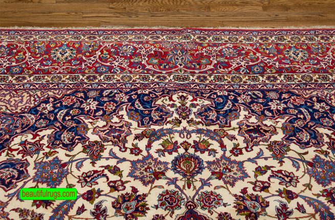 Antique Persian Isfahan rug with beige and red colors. Size 10.2x15.7.