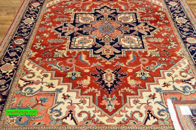 Handmade Persian Heriz wool rug in orange red color. Size 6.6x10.