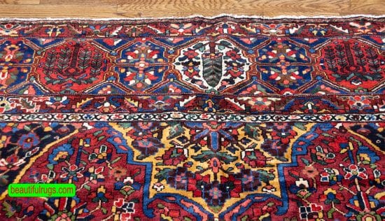 Antique Persian Bakhtiari rugs, floral, geometric rug in red color. Size 12.2x17.