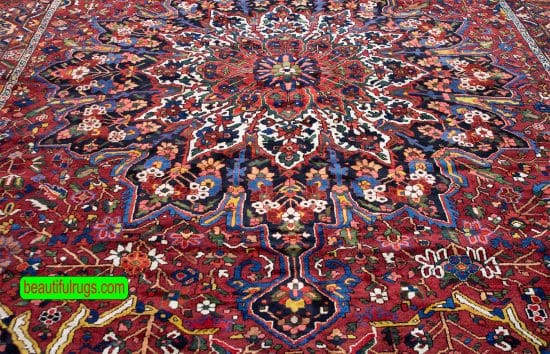 Antique Persian Bakhtiari rugs, floral, geometric rug in red color. Size 12.2x17.