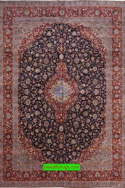 Persian Kashan wool rug with navy blue and red colors. Size 11.4x16.3.