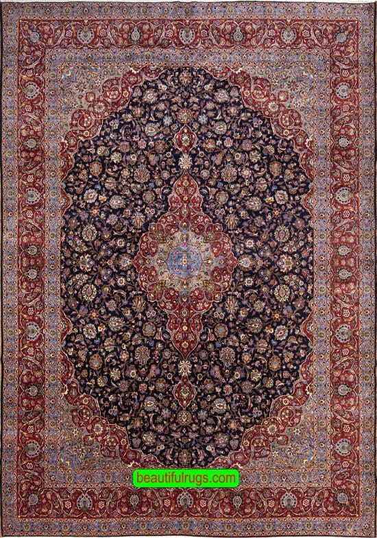 Persian Kashan wool rug with navy blue and red colors. Size 11.4x16.3.