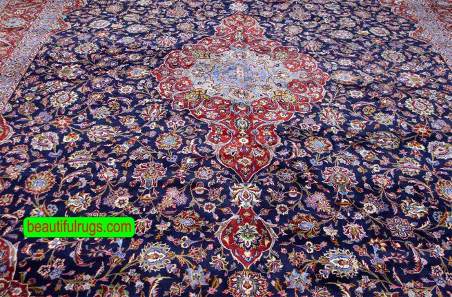 Persian Kashan wool rug with navy blue and red colors. Size 11.4x16.3.