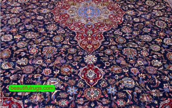 Persian Kashan wool rug with navy blue and red colors. Size 11.4x16.3.