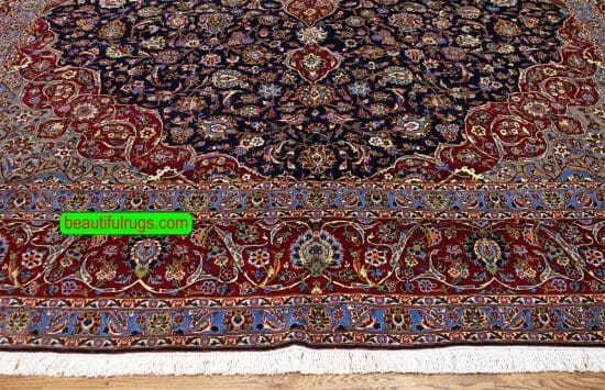 Persian Kashan wool rug with navy blue and red colors. Size 11.4x16.3.