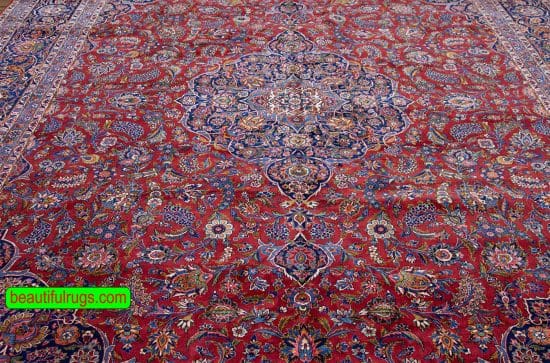 Semi antique Persian Kashan rug with orange red and navy blue color. Size 11.3x14.7.