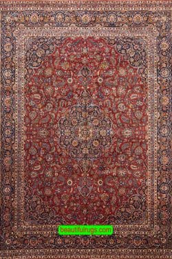 Semi antique Persian Kashan rug with orange red and navy blue color. Size 11.3x14.7.