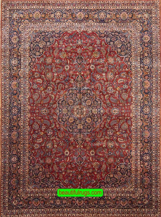 Semi antique Persian Kashan rug with orange red and navy blue color. Size 11.3x14.7.