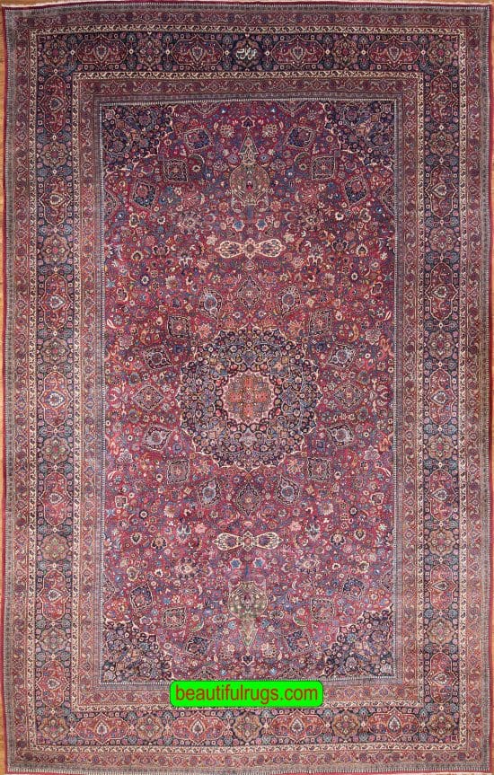 Antique Persian Mashad rug with red and navy blue. Size 12x18.9.