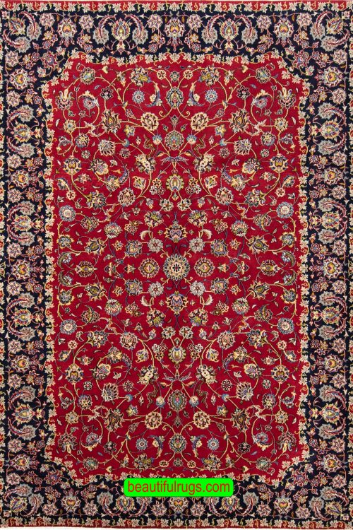 Handmade wool Persian Kashan area rug in red color and allover design. Size 6.6x9.7.