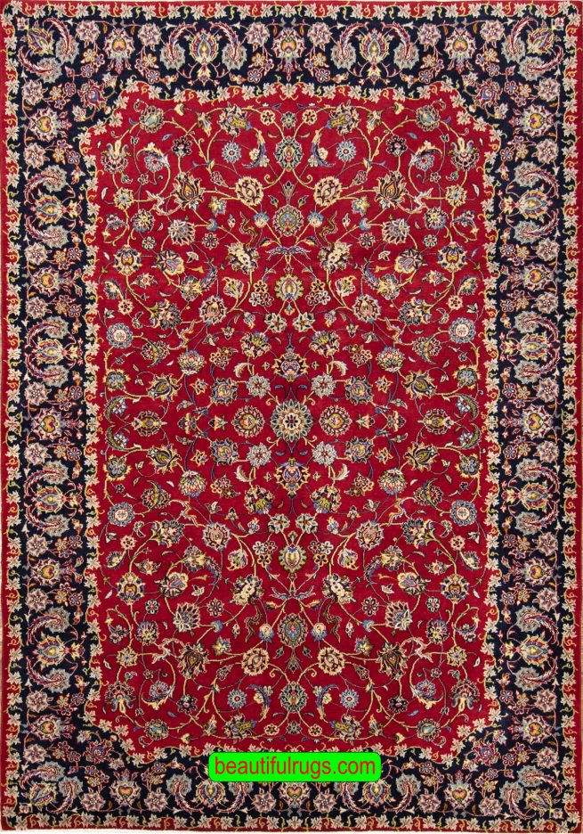 Handmade wool Persian Kashan area rug in red color and allover design. Size 6.6x9.7.