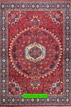 Handmade Persian Tabriz rug in red color. Size 6.10x10.2.