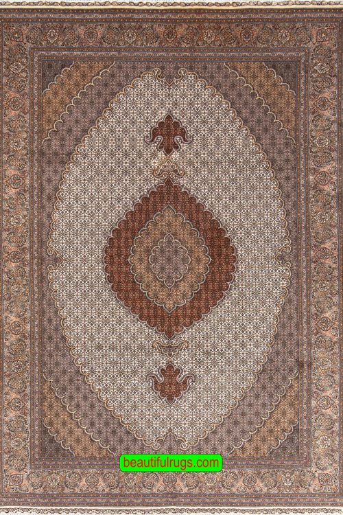 Hand knotted Persian Tabriz wool and silk rug in beige color. Size 6.8x10.