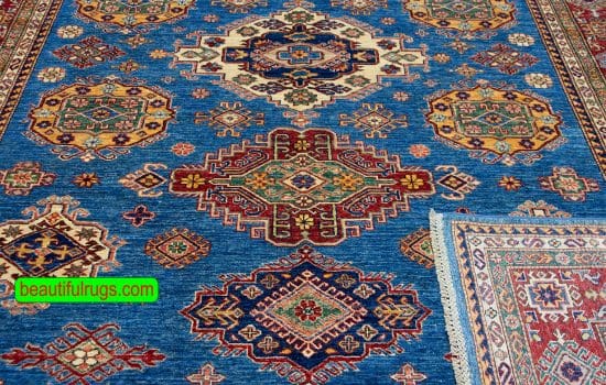 Geometric Kazak style rug in blue color made in Pakistan. Size 8.2x10.6.