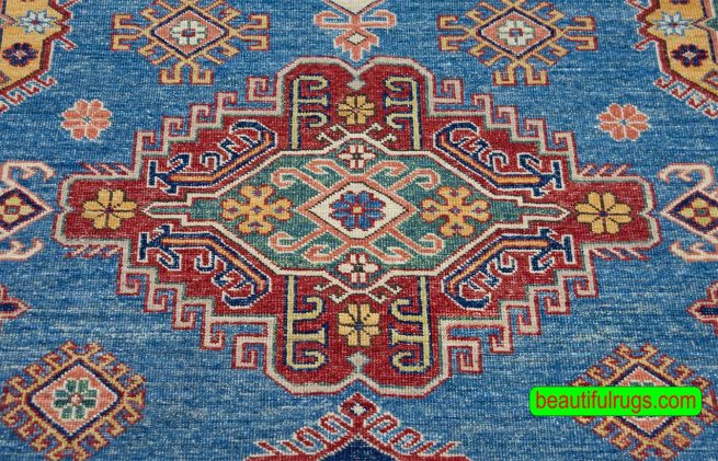 Geometric Kazak style rug in blue color made in Pakistan. Size 8.2x10.6.